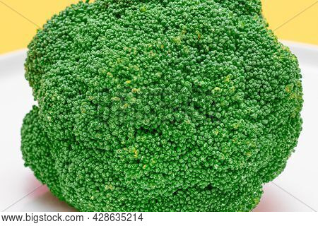Macro Shot Of Fresh And Raw Broccoli - Close-up. Uncooked Green Cabbage. Vegan And Vegetarian Cultur