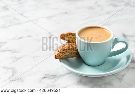 Tasty Cantucci And Cup Of Aromatic Coffee On White Marble Table, Space For Text. Traditional Italian