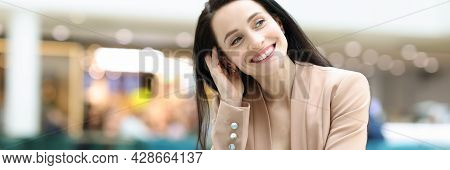 Smiling Happy Woman Is Sitting In Cafe