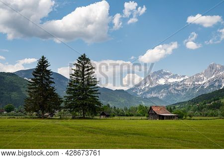 The Austrian Alps Near Admont On A Sunny Day In Summer, National Park Gesaeuse, Green Meadows With Y