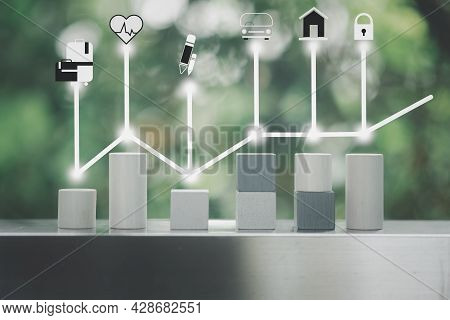 Wooden Block Of Like A Graph With Icons Of Travel, Stay Healthy, Education, Transport, Real Estate A