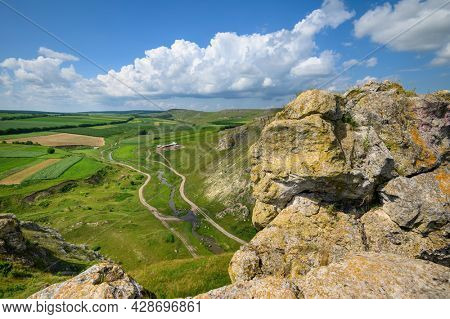 View to limestone toltres, rock residues of ancient coral reefs of dried Sarmatian sea at the North of Moldova
