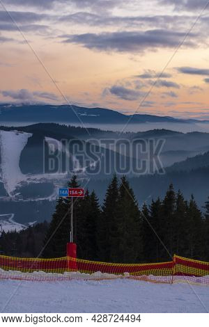 Bukovel, Ukraine - December, 2020: People Are Descending By The Slope In Bukovel Ski Resort. Bukovel