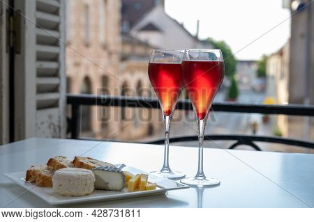 Drinking Of Kir Royal,  French Aperitif Cocktail Made  From Creme De Cassis Topped With Champagne, T