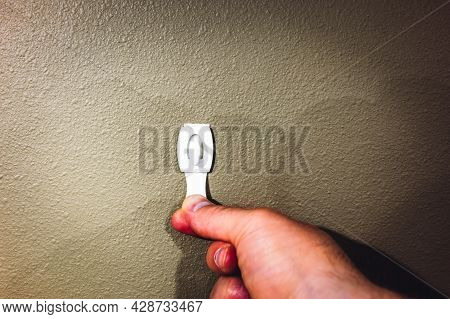 Selective Focus On Adhesive Strip Wall Hanger That Can Be Removed By Pulling Tape