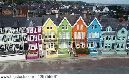 Aerial Video Of Yellow Red Blue Green Orange Painted Houses By The Sea Whitehead N. Ireland