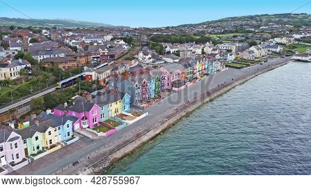 Aerial Video Of Yellow Red Blue Green Orange Painted Houses By The Sea Whitehead N. Ireland