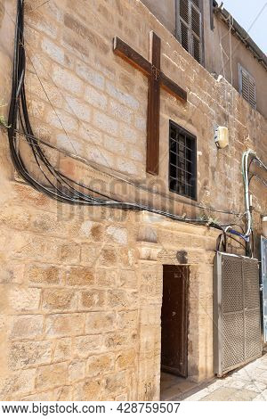 Jerusalem, Israel, July 17, 2021 : Large Wooden Cross Over The Entrance To The Small Feodorovsky Mon