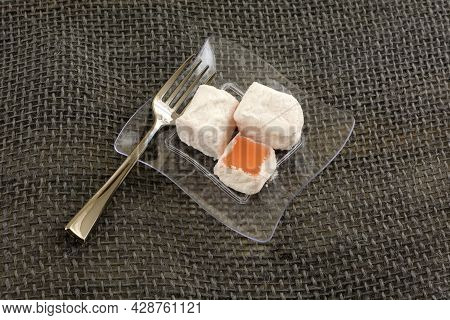Greek Prickly Pear Loukoumi Pieces On Small Transparent Snack Plate With Snack Fork