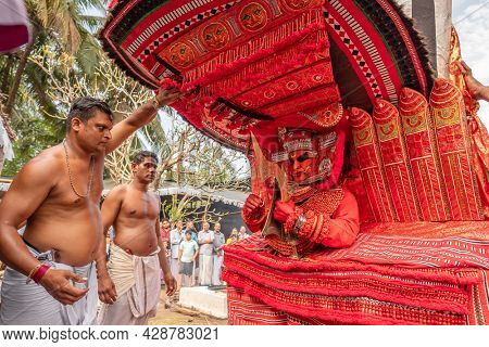 Payyanur, India - December 5, 2019: Theyyam artist perform during temple festival in Payyanur, Kerala, India. Theyyam is a popular ritual form of worship in Kerala, India