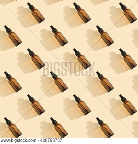 Seamless Pattern. Bottles Of Dark Amber Glass With Essential, Lotion, Serum On A Beige Background. N