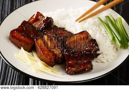 Rafute Is The Okinawan Version Of Simmered Pork Belly Served With Rice Closeup In The Plate On The T