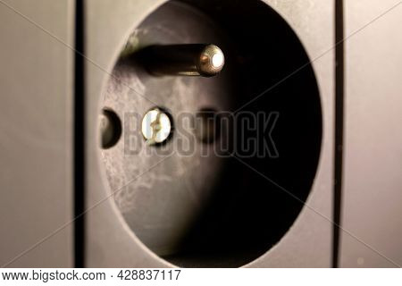 A Close Up Portrait Of A Type E Wall Socket Used To Supply Electric Or Electronic Devices From Power