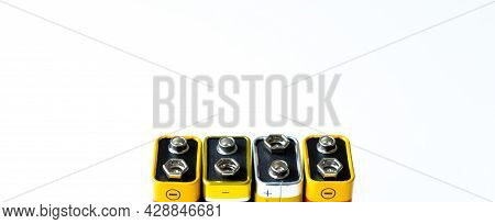 Four Batteries Pp3 On A Row On White Background Isolated. Connector Batteries.