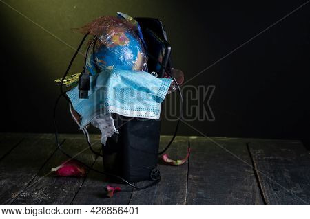 Trash Can Filled. A Trash Can With A Variety Of Rubbish. Yellow Ray Of Light On The Trash. Copy Spac