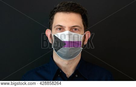 Portrait Of An Adult Man Wearing A Lgbt Demisexual Flag Colors Facial Mask. Lgbt Gay Rights Concept 