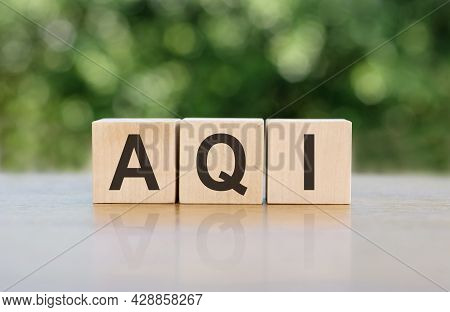 Aqi Abbreviation Of Air Quality Index Word Written On Wooden Blocks. The Text Is Written In Black Le