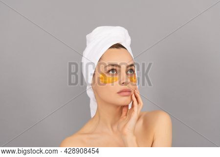 The Softest Skin. Moisturizing Skin. Cosmetology. Young Woman In Terry Towel Use Patch.