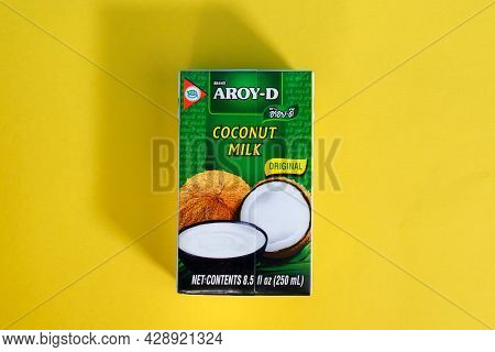 Tyumen, Russia - April 14, 2021: Brand Aroy-d Coconut Milk. Flat Lay