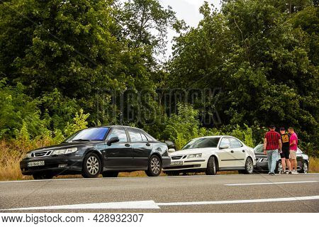 Chernigov, Ukraine - July 24, 2021: Saab Cars And People On The Road. Saab 9-5 And White Saab 9-3 On