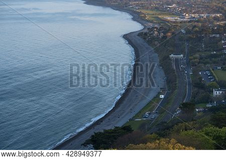 Beautiful Aerial-like Evening View Of Killiney Beach, Coastal Line And Railway Seen From Killiney Hi