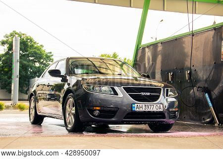 Chernigov, Ukraine - July 24, 2021: Saab Car At A Car Wash. Gray Saab 9-5 Car At A Self-service Car 