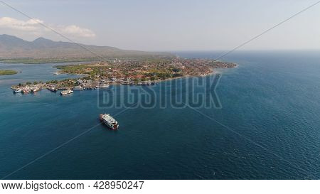 Aerial View Ferry Port Gilimanuk With Ferry Boats, Vehicles. Ferries Transport Vehicles And Passenge