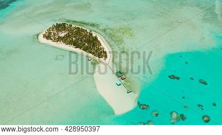 Tropical Island Among Coral Reefs With A White Beach And Blue Atoll Water. Onok Island, Balabac, Phi