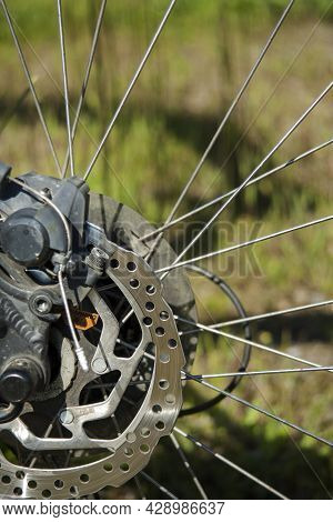 Close Up Rear Disc Brakes For Bicycle. Detail Of Breaking Mechanism.