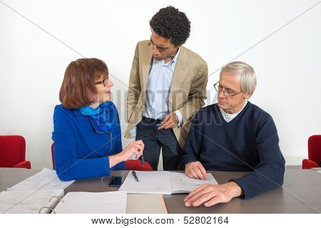 Business people talking with their tutor during a supplementary training session