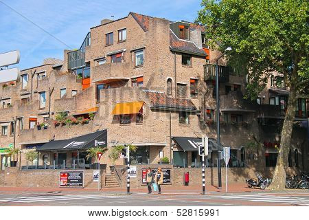 Pedestrians Are At A Crossroads Near A Beautiful Building  In Dordrecht, Netherlands