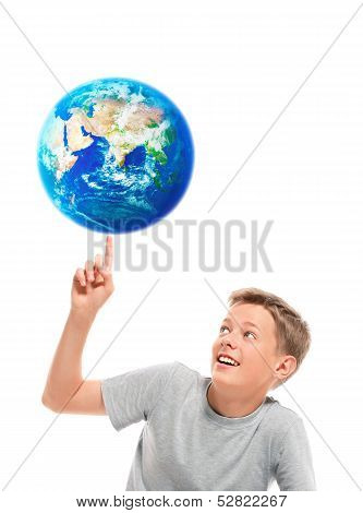 Boy holding planet earth on his finger