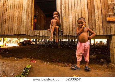 BERDUT, MALAYSIA - APR 8: Unidentified children Orang Asli in his village on Apr 8, 2013 in Berdut, Malaysia. More than 76% of all Orang Asli live below the poverty line, life expectancy-53 years old.