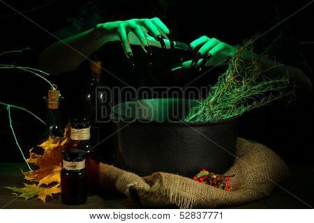  Witch in scary Halloween laboratory on dark color background