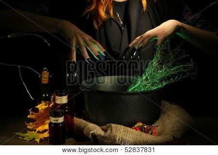  Witch in scary Halloween laboratory on dark color background