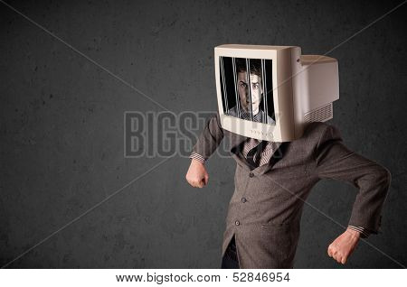 Business man with monitor screen on his head traped into a digital system concept