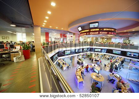 MOSCOW - MAR 5: People working in office news agency RIA Novosti with tables around on March 5, 2013 in Moscow, Russia.