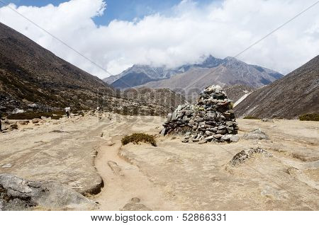 Buddhists Prayer Flags And Stone Pyramids Often Marks The Mountain Pass Or Holy Place In Himalayas
