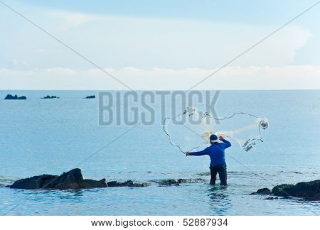 A Fisherman Throw The Net