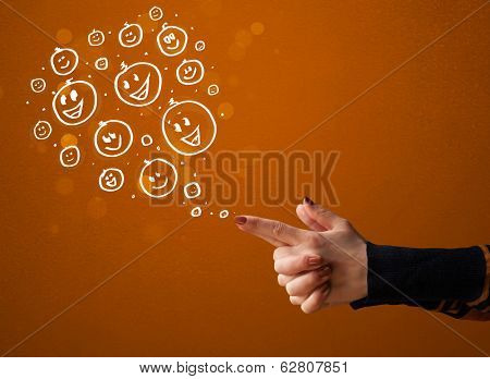Group of happy hand drawed smiley faces coming out of gun shaped hands