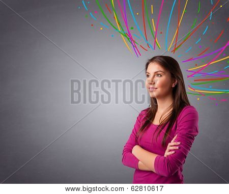 Pretty young girl thinking with colorful abstract lines overhead