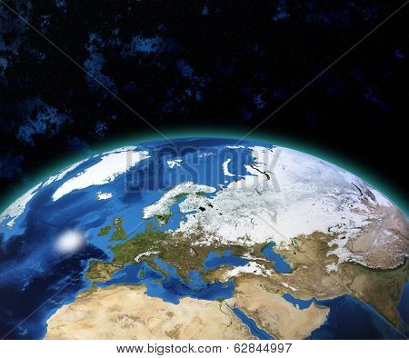 Planet Earth with sun rising over European countries (Elements of this image furnished by NASA)