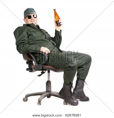Worker in glasses sitting with beer.