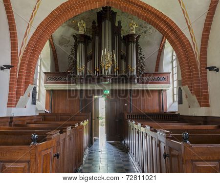 Interior With Open Door Of Church Den Andel