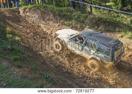 Big Dark Off Road Car Is Hitting A Hill