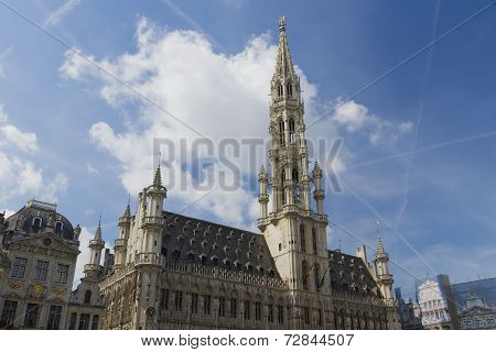 Brussels Town Hall, Grand Place, Belgium. Clouds And Blue Sky.