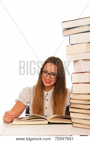 Happy Asian Caucasian Girl Lerning In Study Woth Lots Of Books On The Table