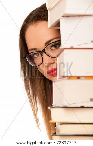 Happy Asian Caucasian Girl Lerning In Study Woth Lots Of Books On The Table