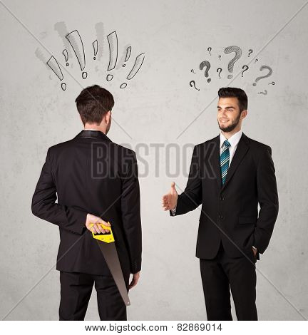 Ruthless businessman handshake with drawn exclamation and question marks around them head