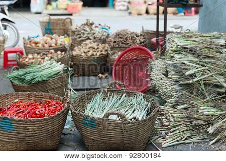 asian street market basket red chilly pepper greens